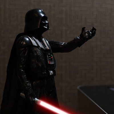 Darth Vader doll holding a lemo connector